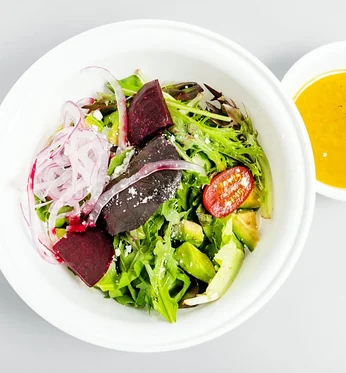 Rocky House Salad: mixed greens, golden and red beet, tomato and avocado with citrus dressing on the side