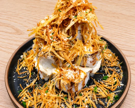 Rocky Mountain Roll piled high with crispy shredded potato and cream cheese sauce